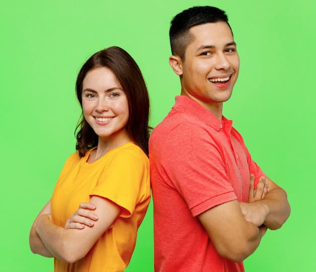 Two people standing back to back with arms folded
